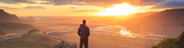 Rapid Detox Location; Man standing watching the sunset in the hills